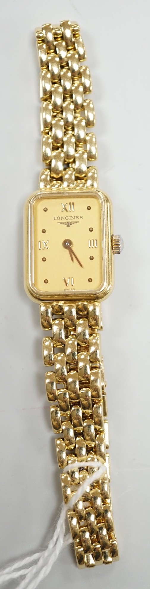 A lady's 2001 18ct gold Longines quartz wrist watch, with rectangular part Roman dial, on 18ct gold Longines bracelet, with original receipt and papers, no box